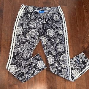 Adidas track pants / joggers in black and white floral, L